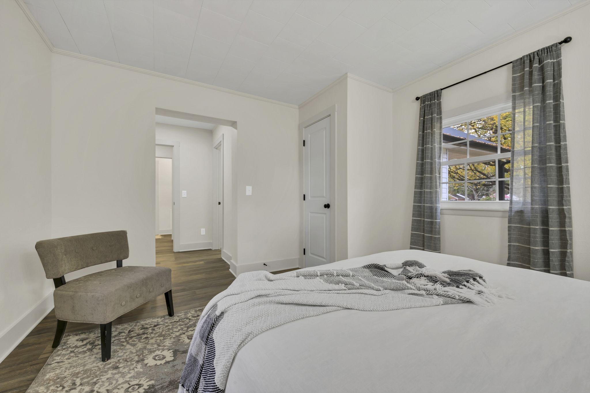 100 Brook Drive Dickson, TN 37055 - Photo 12 of 23 a bedroom with a bed and wooden floor