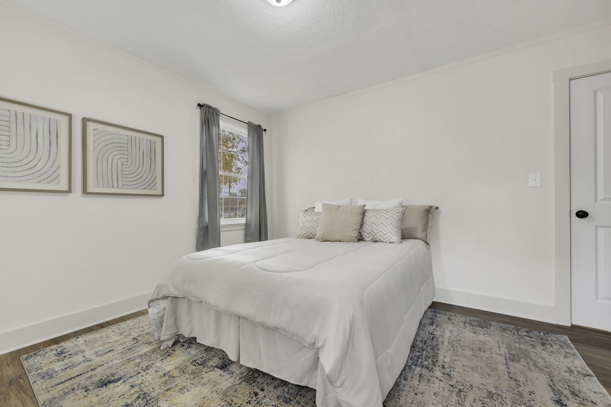 100 Brook Drive Dickson, TN 37055 - Photo 18 of 23 a bedroom with a bed and painting on the wall