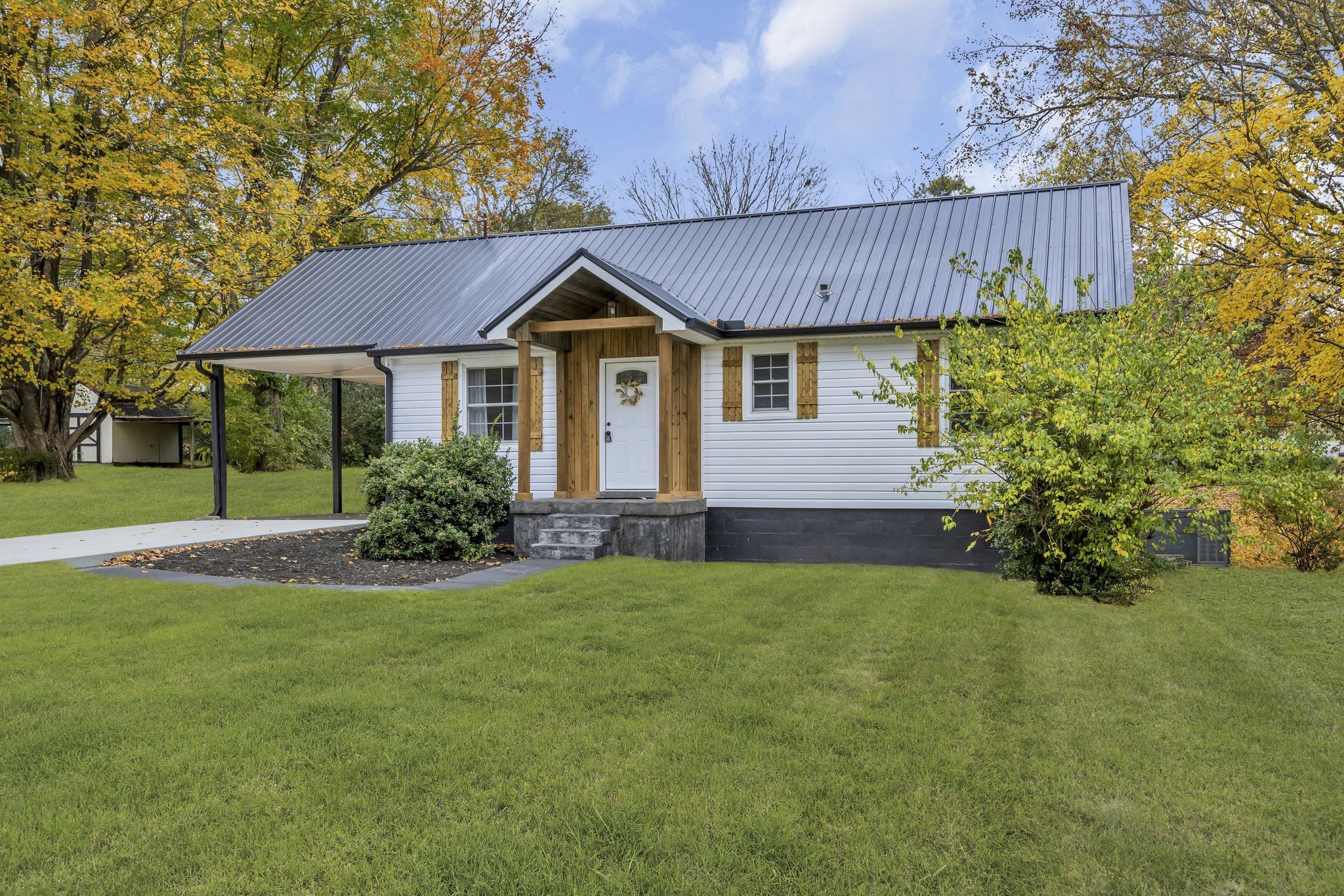 100 Brook Drive Dickson, TN 37055 - Photo 22 of 23 a view of a house with a yard and tree s
