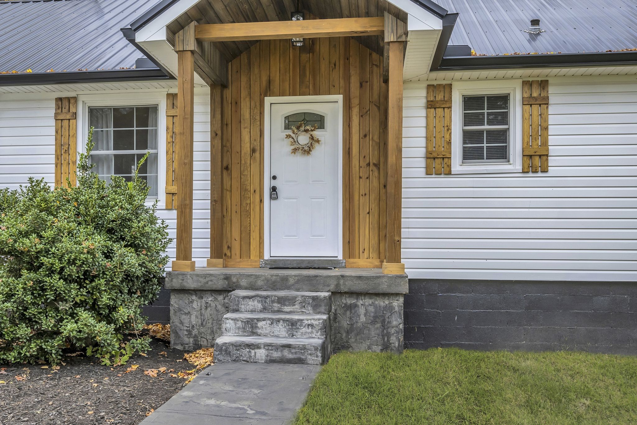 100 Brook Drive Dickson, TN 37055 - Photo 3 of 23 a front view of a house with garden