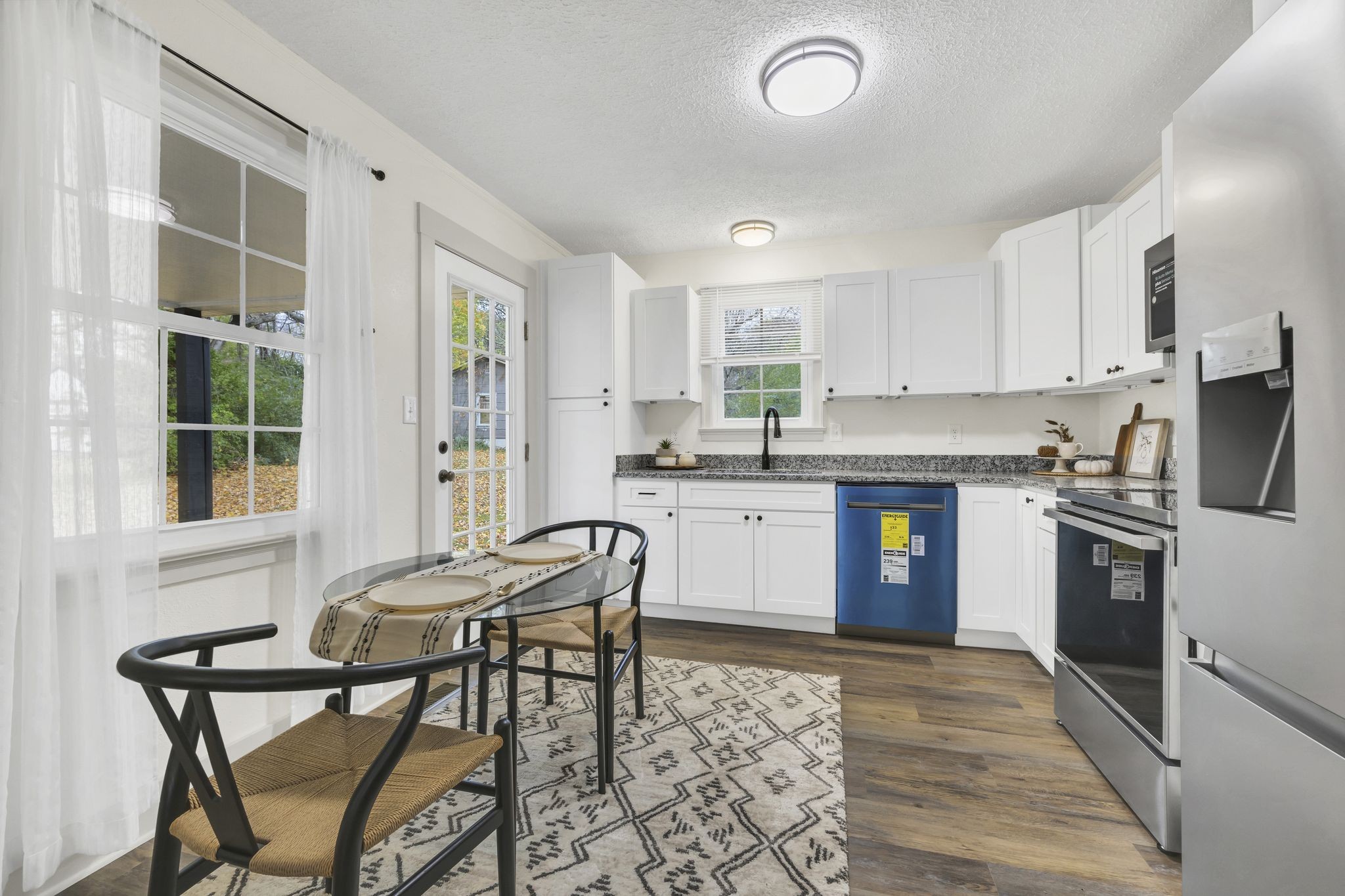 100 Brook Drive Dickson, TN 37055 - Photo 9 of 23 a kitchen with granite countertop a sink stainless steel appliances and cabinets
