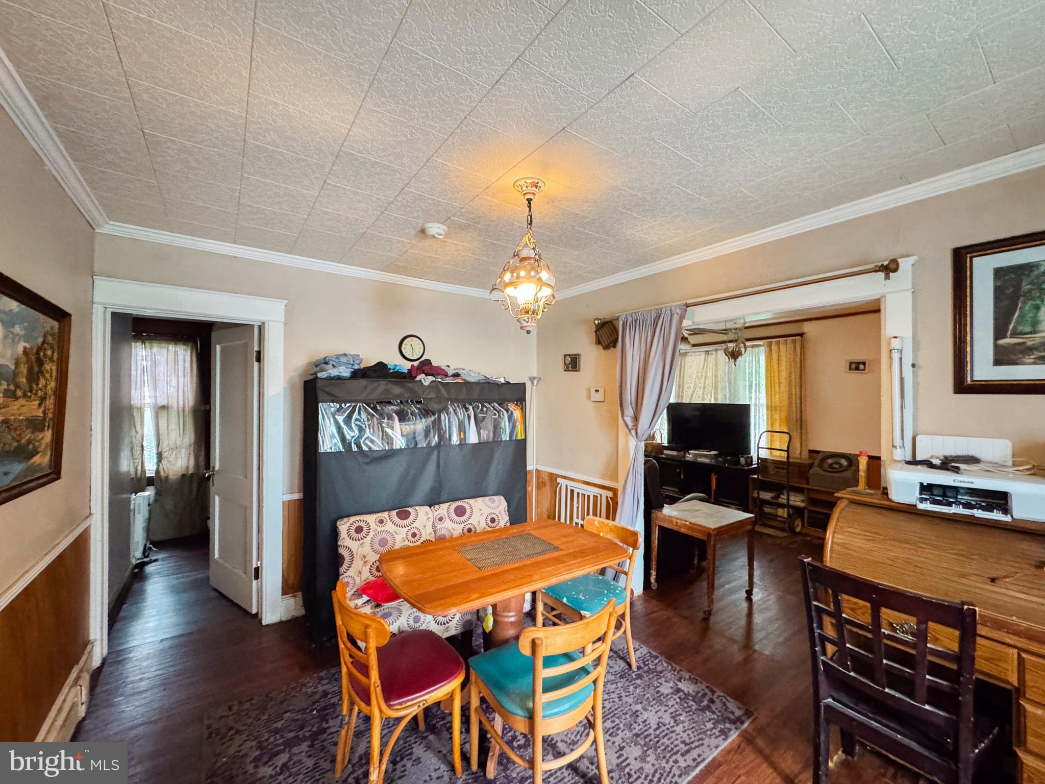 416 Dry Valley Road Burnham, PA 17009 - Photo 8 of 23 a very nice looking dining room with kitchen island stainless steel appliances furniture a chandelier a large window and a kitchen view