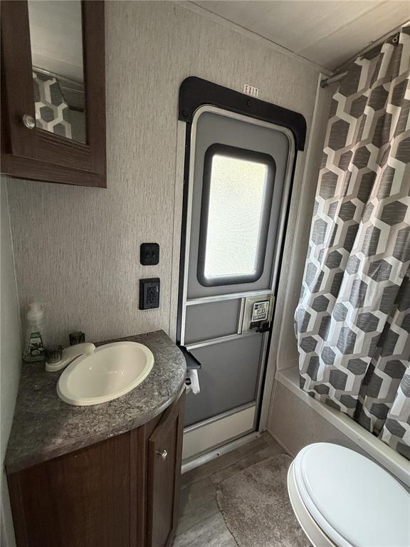 3000 Clarcona Road, Unit 743 Apopka, FL 32703 - Photo 45 of 54 a bathroom with a granite countertop sink and a mirror