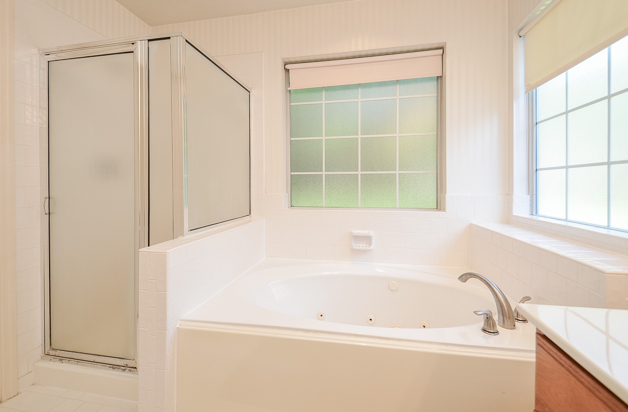 811 Spring Valley Court Sugar Land, TX 77479 - Photo 14 of 33 a bathroom with a bathtub and a shower