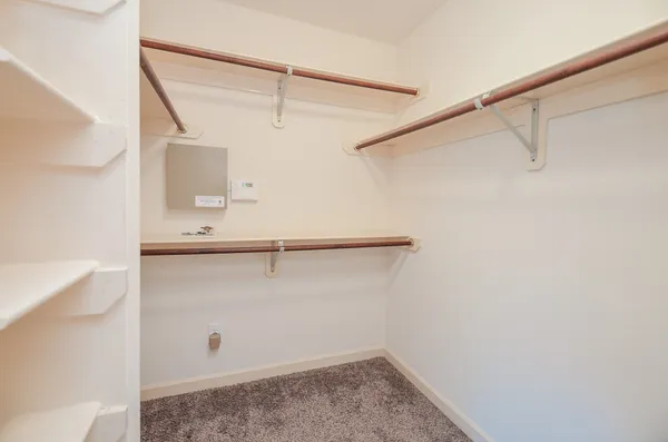 a view of an empty walk in closet