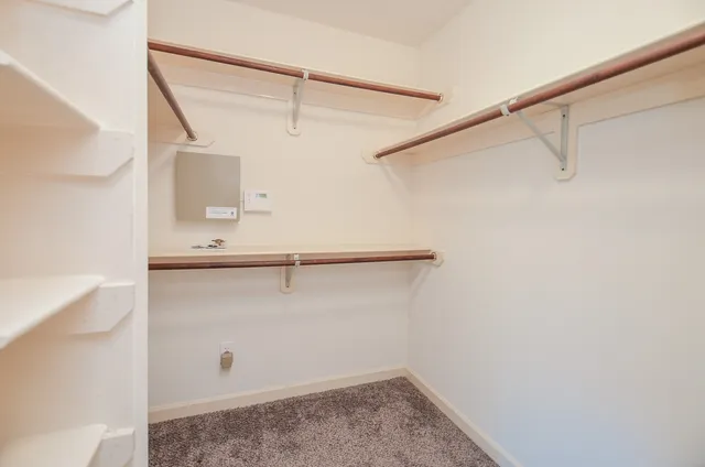 a view of an empty walk in closet