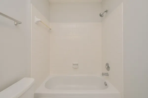 a view of yard with swimming pool and green space