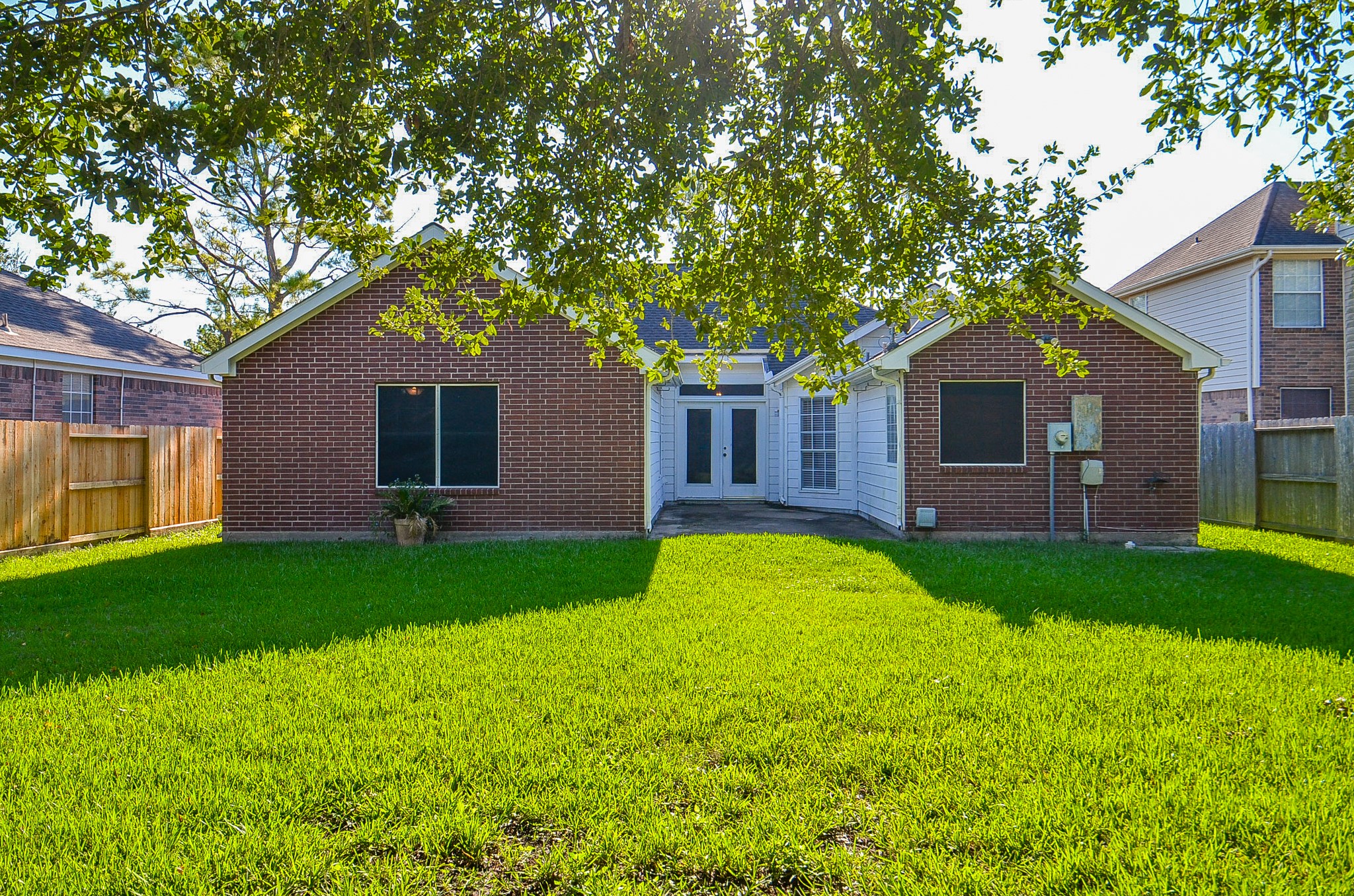 811 Spring Valley Court Sugar Land, TX 77479 - Photo 23 of 33 a front view of house with yard and green space