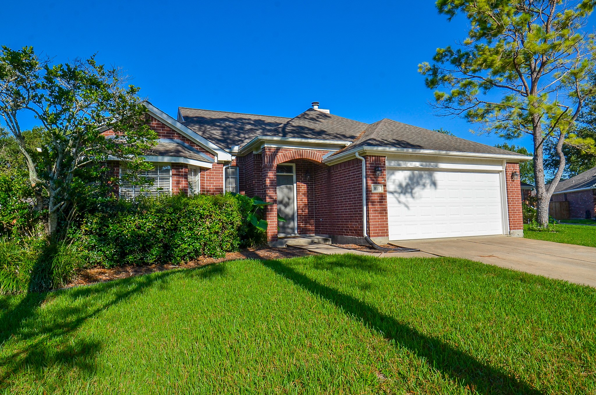 811 Spring Valley Court Sugar Land, TX 77479 - Photo 3 of 33 a front view of a house with a yard