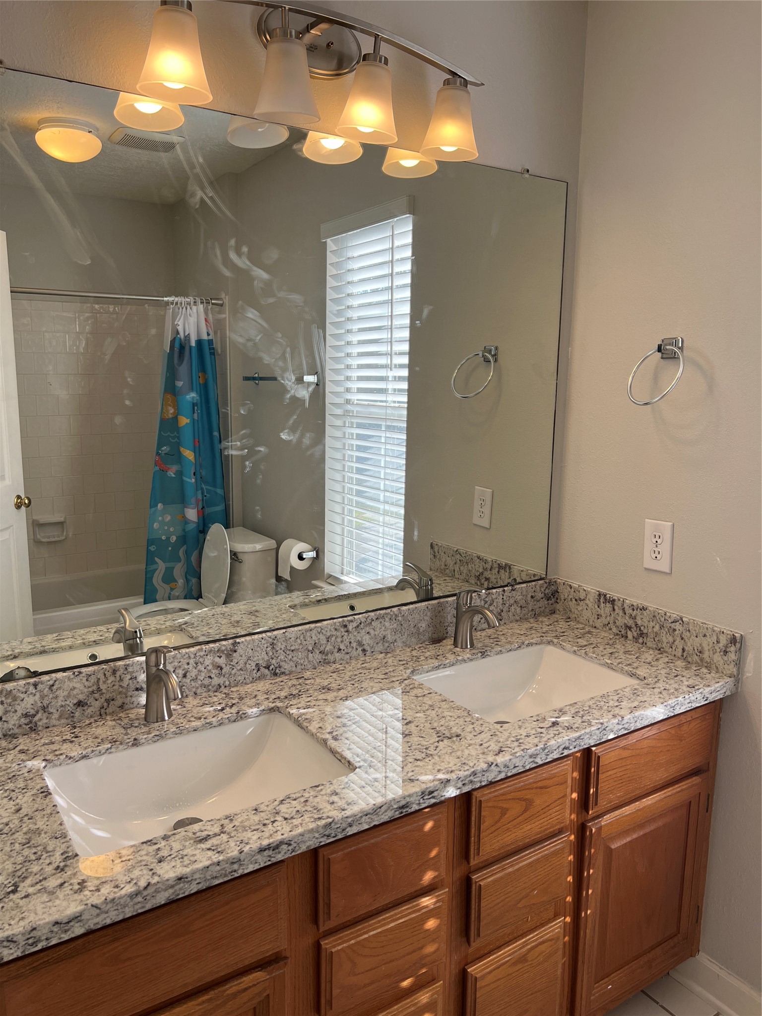 811 Spring Valley Court Sugar Land, TX 77479 - Photo 32 of 33 a bathroom with a granite countertop sink and a mirror