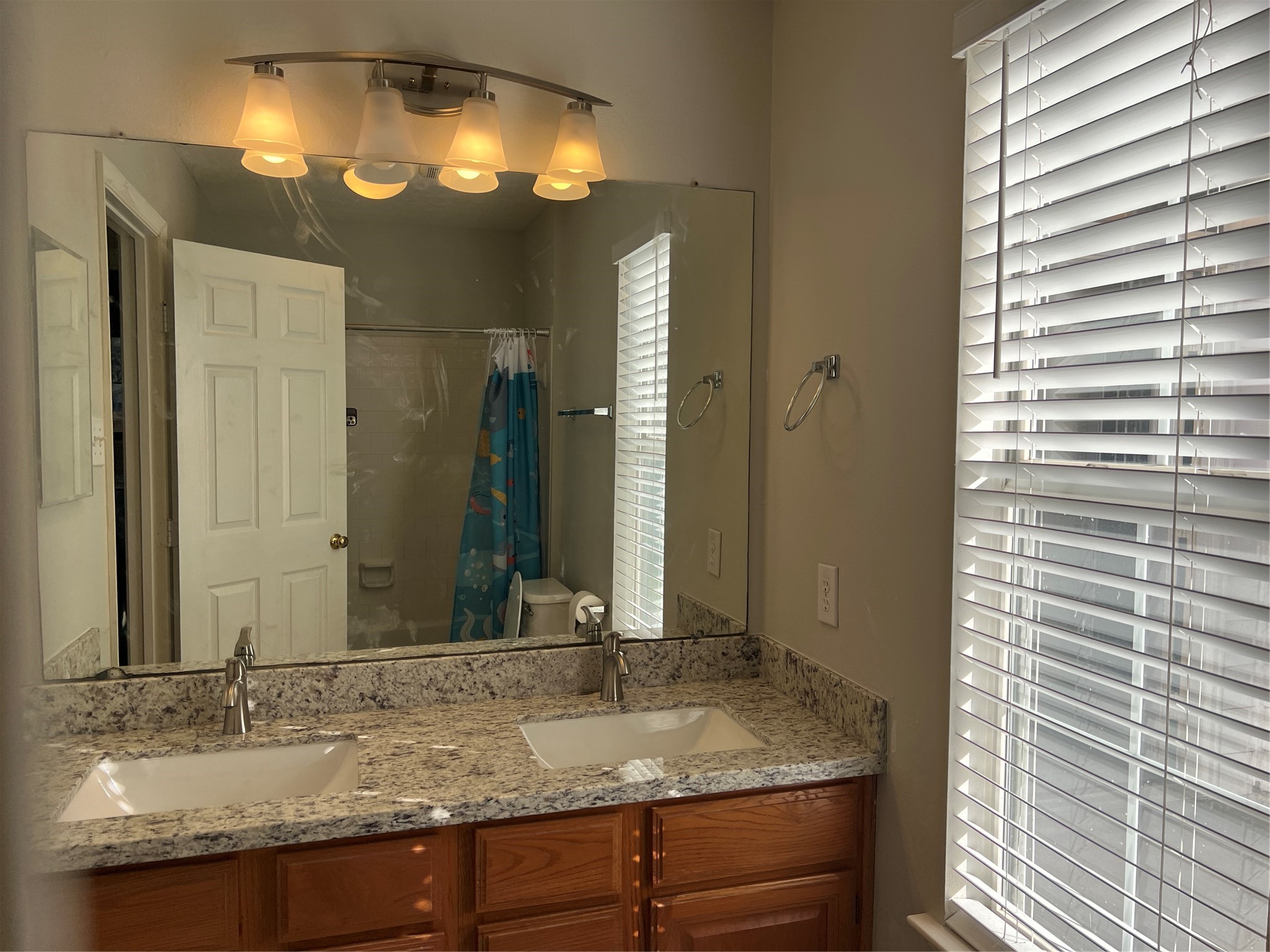 811 Spring Valley Court Sugar Land, TX 77479 - Photo 33 of 33 a bathroom with a granite countertop sink and a mirror