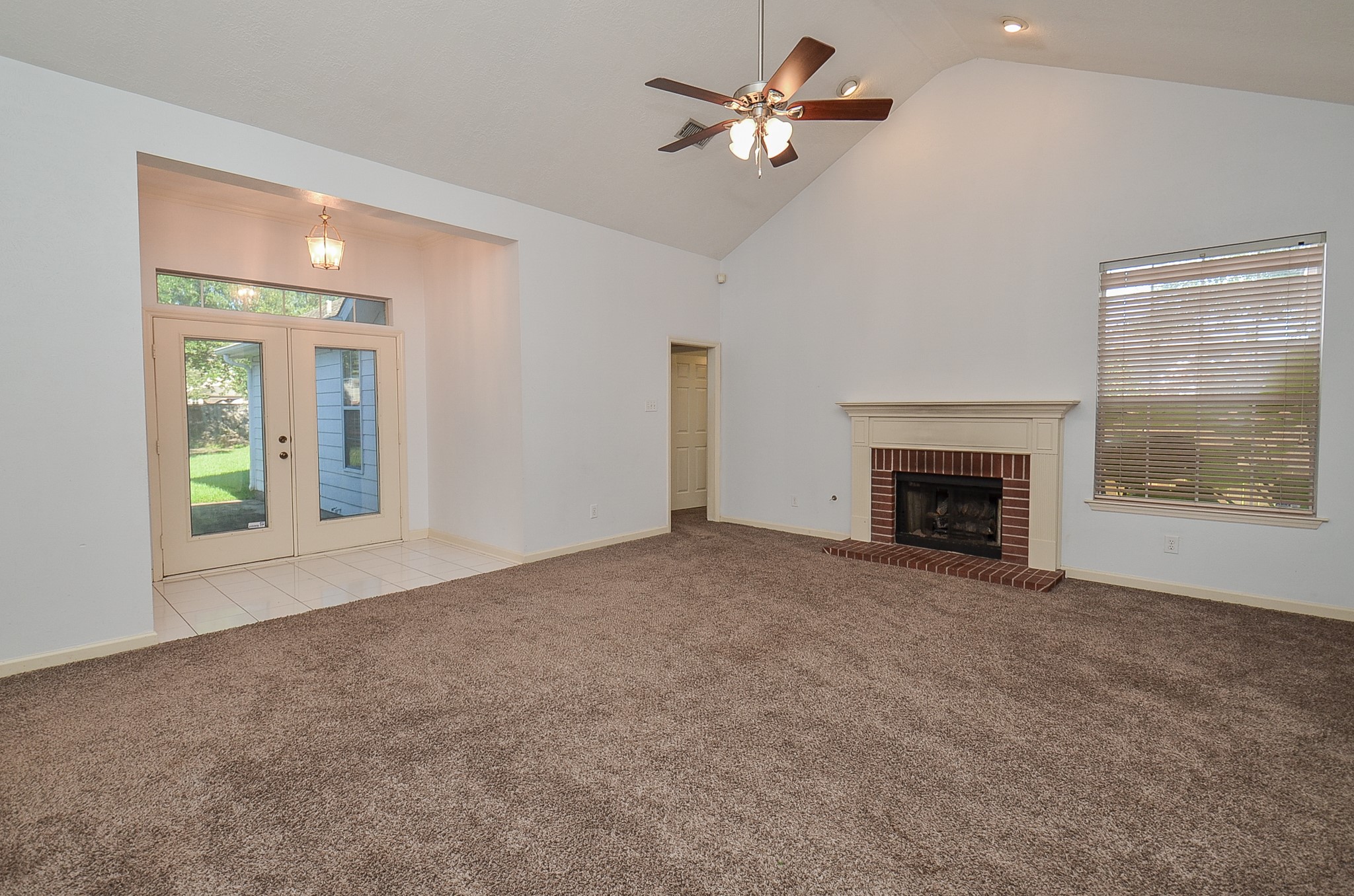 811 Spring Valley Court Sugar Land, TX 77479 - Photo 7 of 33 a view of empty room with fireplace and fan
