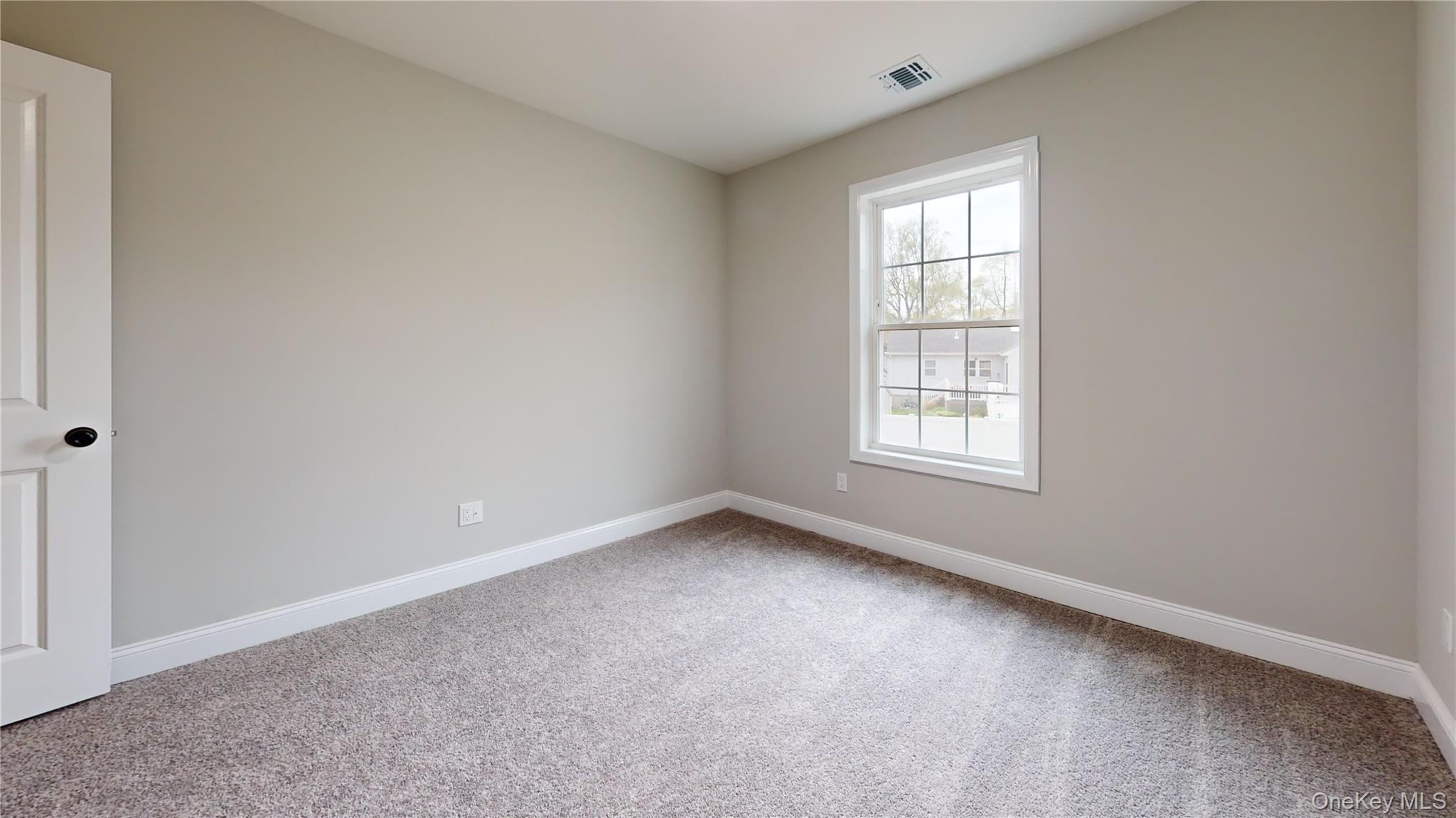 492 Blue Point Road Farmingville, NY 11738 - Photo 13 of 21 an empty room with a window