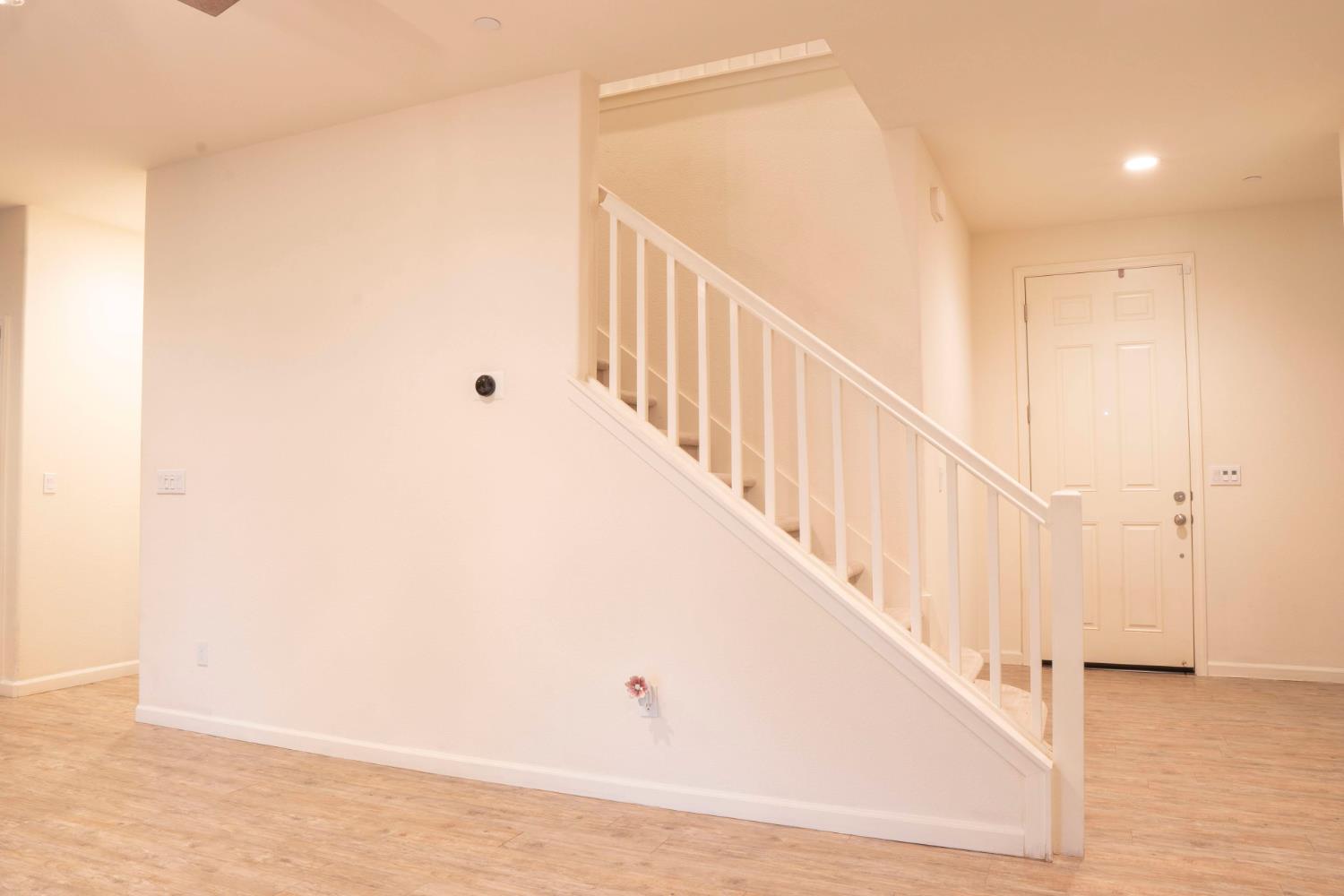 6974 East Atchison Street Fresno, CA 93727 - Photo 15 of 40 a view of a hallway with staircase