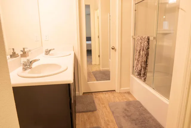 a en suite bathroom with a sink a mirror and a toilet
