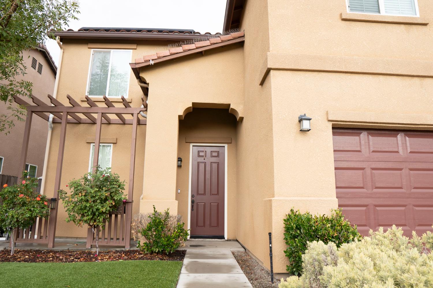 6974 East Atchison Street Fresno, CA 93727 - Photo 5 of 40 a house view with a outdoor space