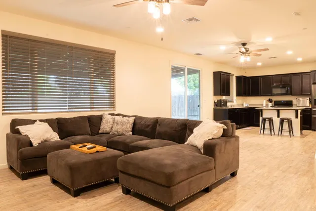 a living room with furniture and a large window