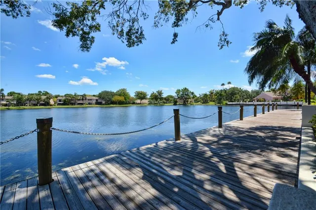 an aerial view of a house with a lake view