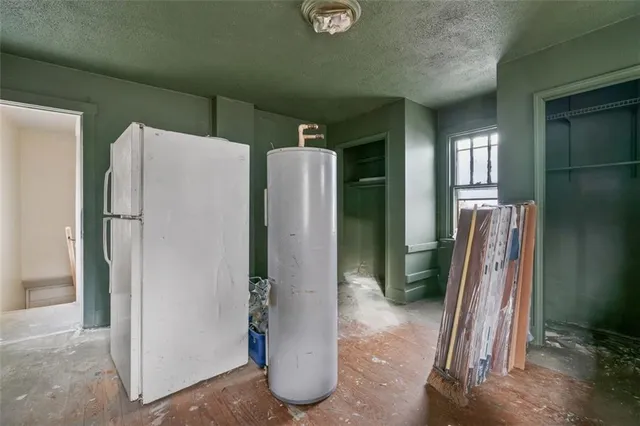 a view of a kitchen with refrigerator and washer