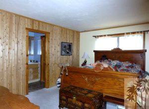 24640 Fern Valley Road Idyllwild, CA 92549 - Photo 3 of 18 a bed room with a bed and a window