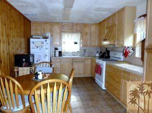 24640 Fern Valley Road Idyllwild, CA 92549 - Photo 8 of 18 a kitchen with a stove a sink a refrigerator and a cabinets