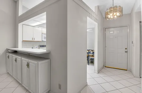 a kitchen with cabinets and white appliances