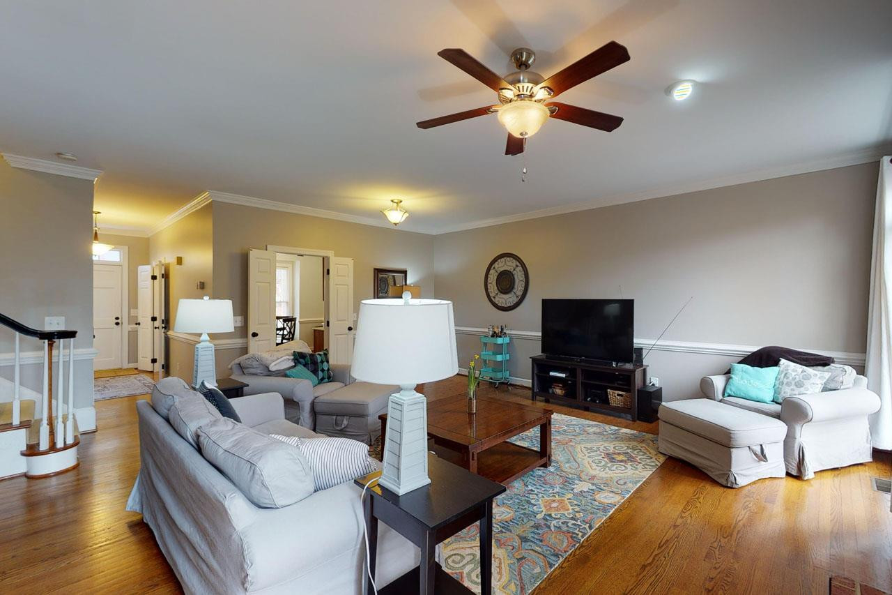6008 Cobridge Square Raleigh, NC 27609 - Photo 10 of 30 Beautiful hardwood floors and ample lighting Den/Family/Great Room