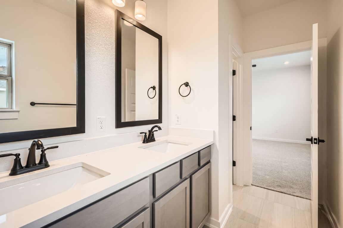 6300 Stockman Drive, Unit 5 Austin, TX 78747 - Photo 20 of 32 a bathroom with a sink and a mirror