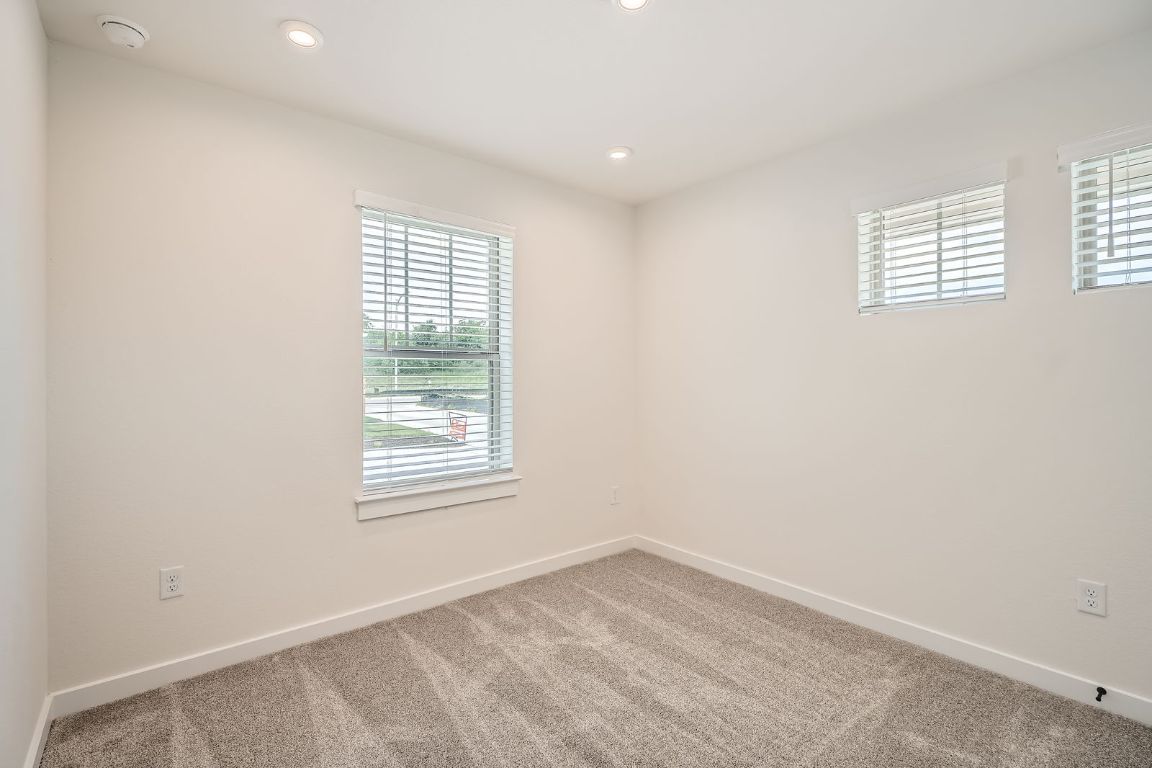 6300 Stockman Drive, Unit 5 Austin, TX 78747 - Photo 8 of 32 an empty room with windows