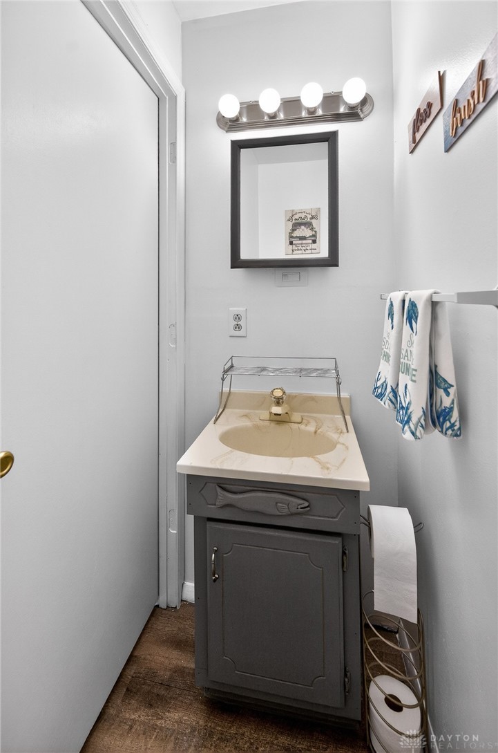 3301 Wildwood Road Middletown, OH 45042 - Photo 17 of 68 This clean bathroom features a sleek vanity and a mirror, offering practicality and style.