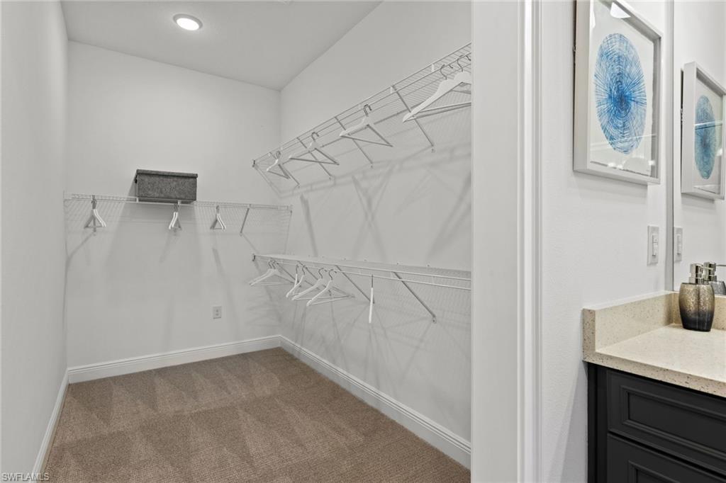 4558 Arboretum Circle, Unit 104 Naples, FL 34112 - Photo 16 of 19 a bathroom with a sink and a shower