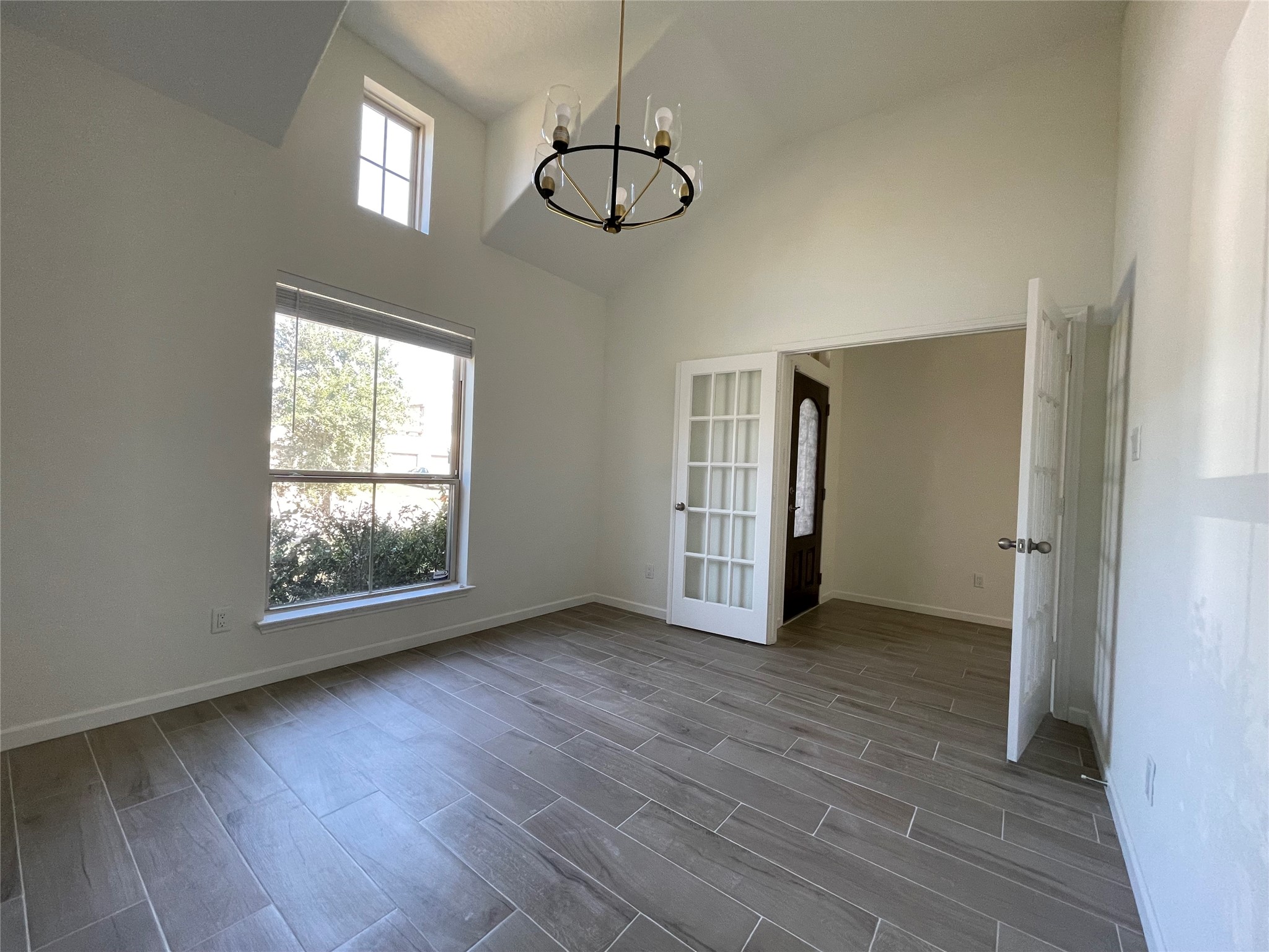 4118 Guild Meadows Drive Houston, TX 77084 - Photo 5 of 35 a view of an empty room with wooden floor and a window