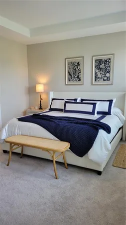 a living room with furniture and a lamp