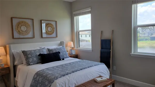 a bedroom with a bed and window