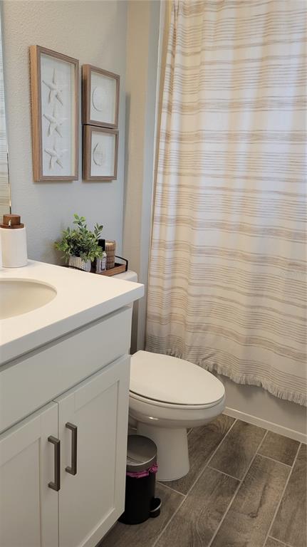 5419 Summit Glen Bradenton, FL 34203 - Photo 18 of 38 a bathroom with a sink a toilet and mirror