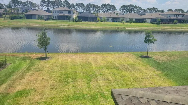 a view of a swimming pool with a lake view
