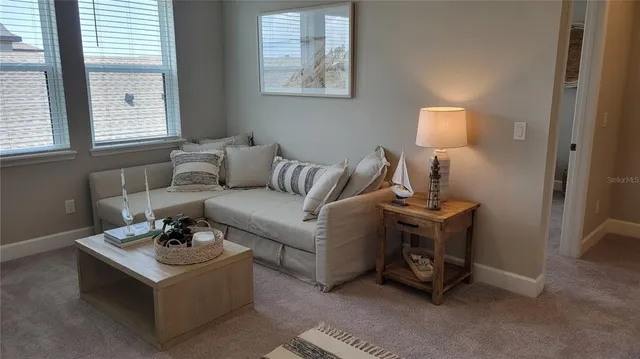 a living room with furniture and a window