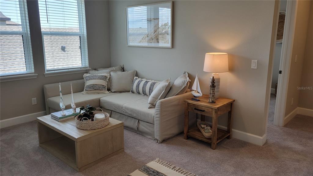 5419 Summit Glen Bradenton, FL 34203 - Photo 21 of 38 a living room with furniture and a window