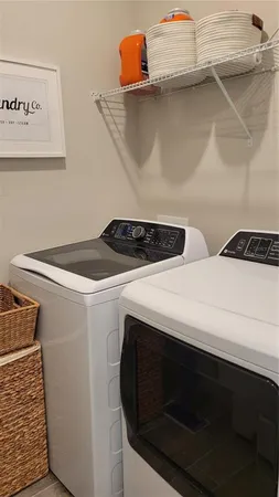 a utility room with dryer and washer