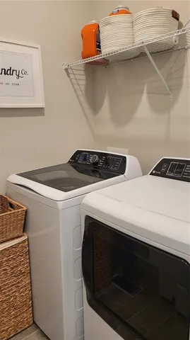 a utility room with dryer and washer
