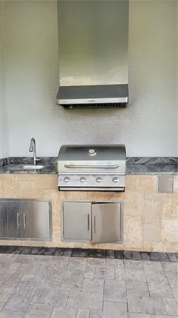 a stove top oven sitting inside of a kitchen