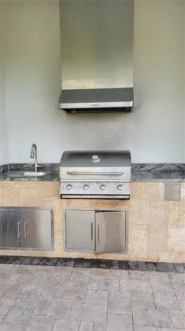 a stove top oven sitting inside of a kitchen