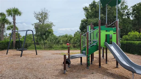 a view of park with a slide