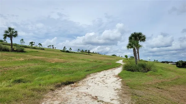 a view of a garden with a house