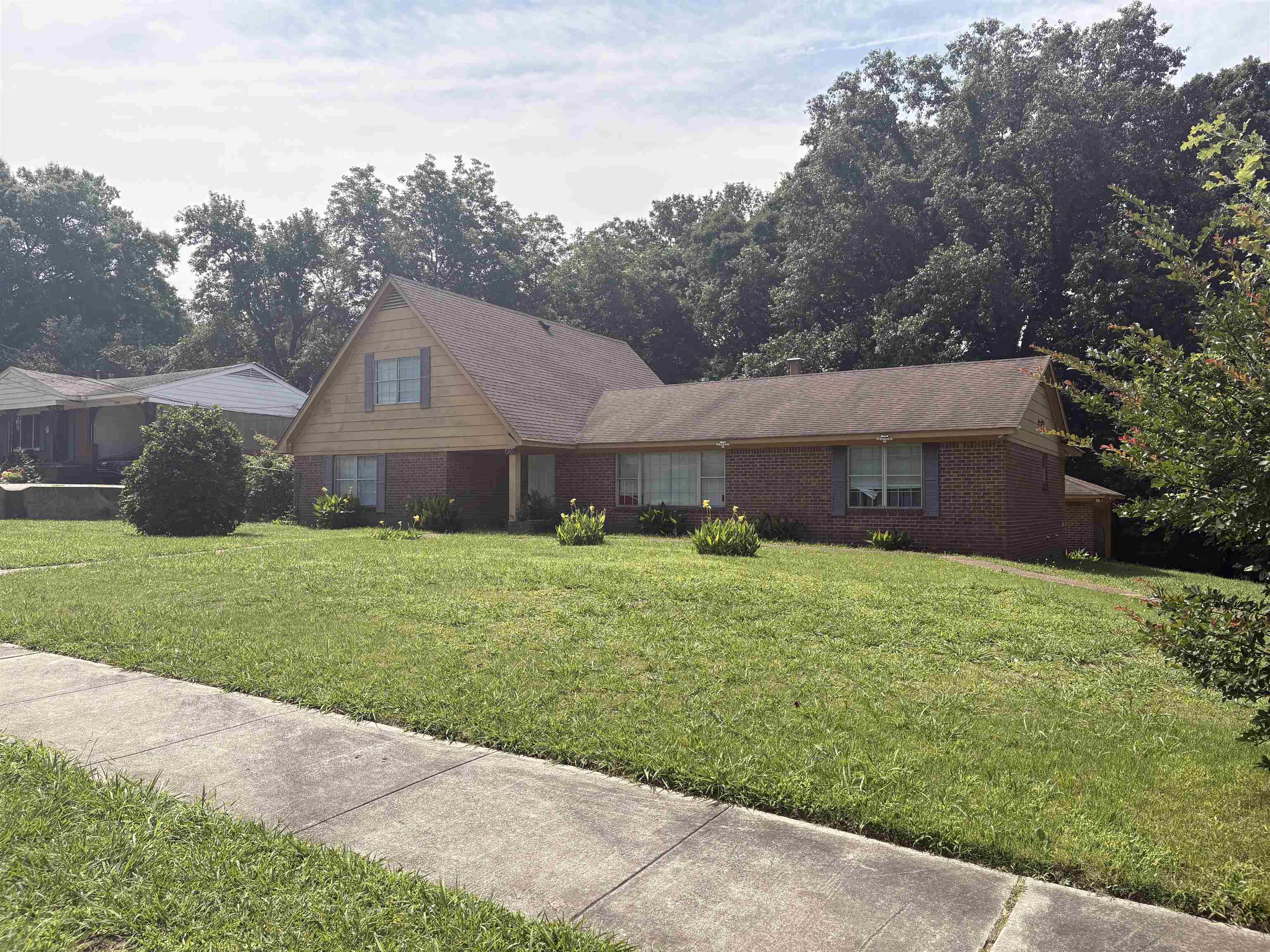 4009 Tessland Road Memphis, TN 38128 - Photo 2 of 16 Brick and siding exterior residence with an expansive front lawn