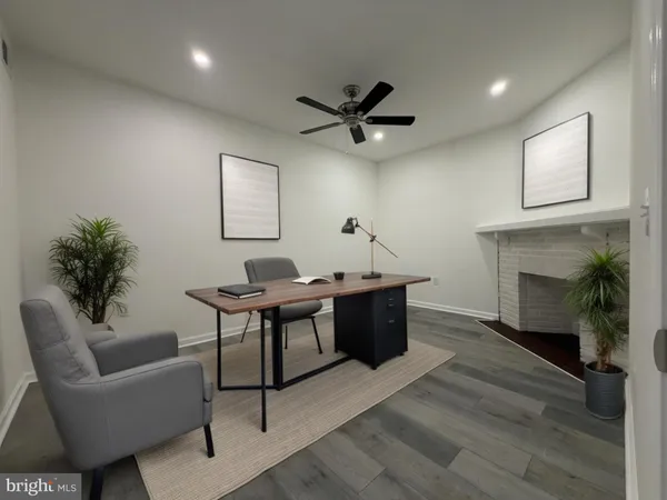 a view of a livingroom with furniture and a fireplace