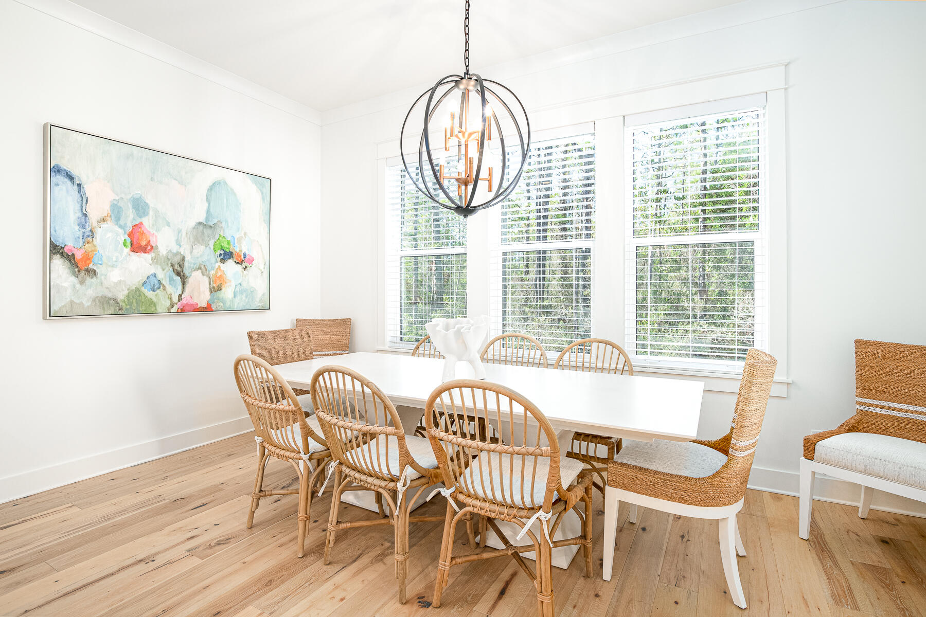 299 Ridgewalk Circle Santa Rosa Beach, FL 32459 - Photo 17 of 46 a view of a dining room with furniture wooden floor and a chandelier
