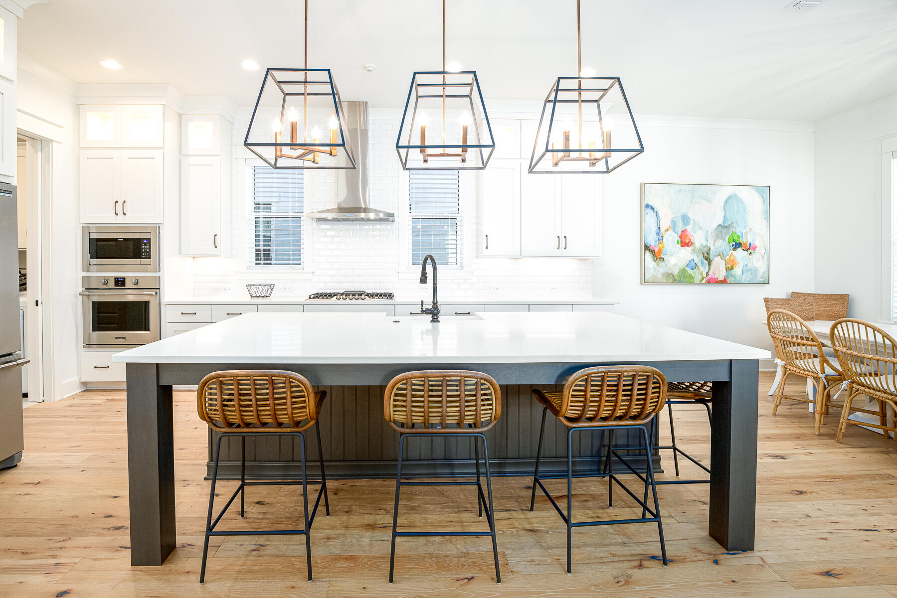 299 Ridgewalk Circle Santa Rosa Beach, FL 32459 - Photo 2 of 46 a table with chairs and painting on the wall