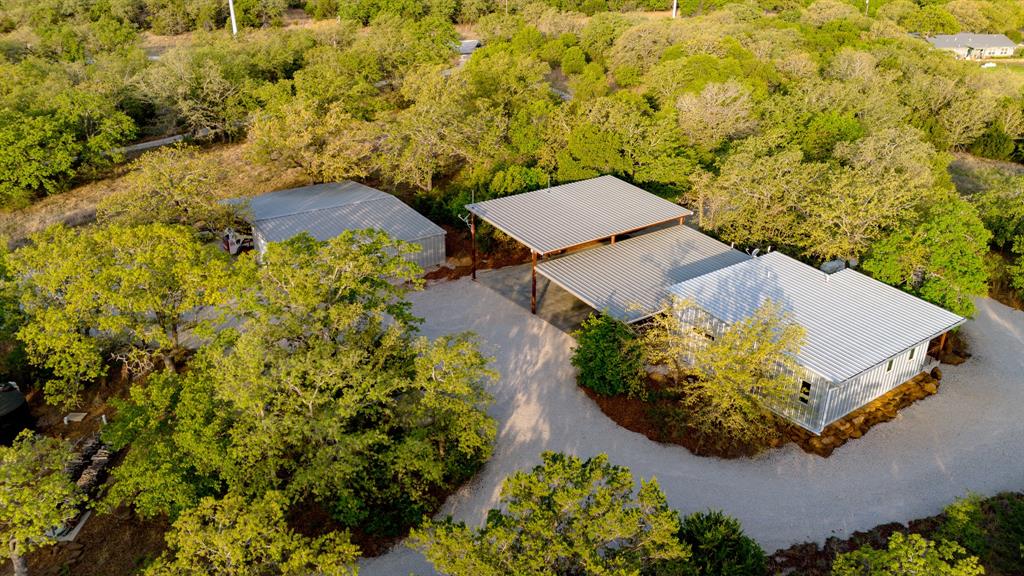3257 Finis Road Graham, TX 76450 - Photo 11 of 40 an aerial view of a house with a yard and garden