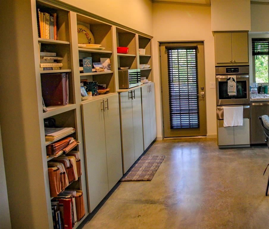 3257 Finis Road Graham, TX 76450 - Photo 33 of 40 a view of walk in closet with clothes and shoes